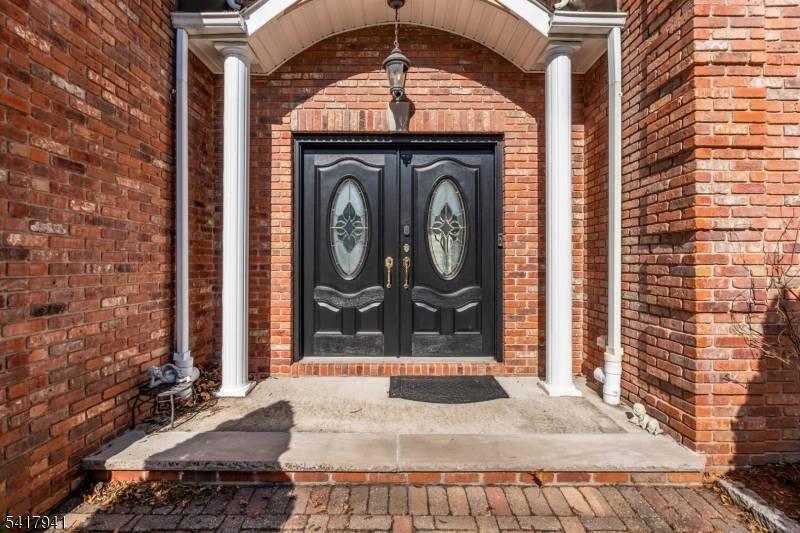 Welcome to this absolutely stunning Colonial featuring a beautiful brick front and professionally landscaped grounds.
