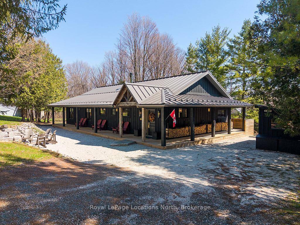 Welcome to 105 Wodehouse Court, a sophisticated ranch style bungalow that perfectly balances modern designer living with soul warming cabin comfort.