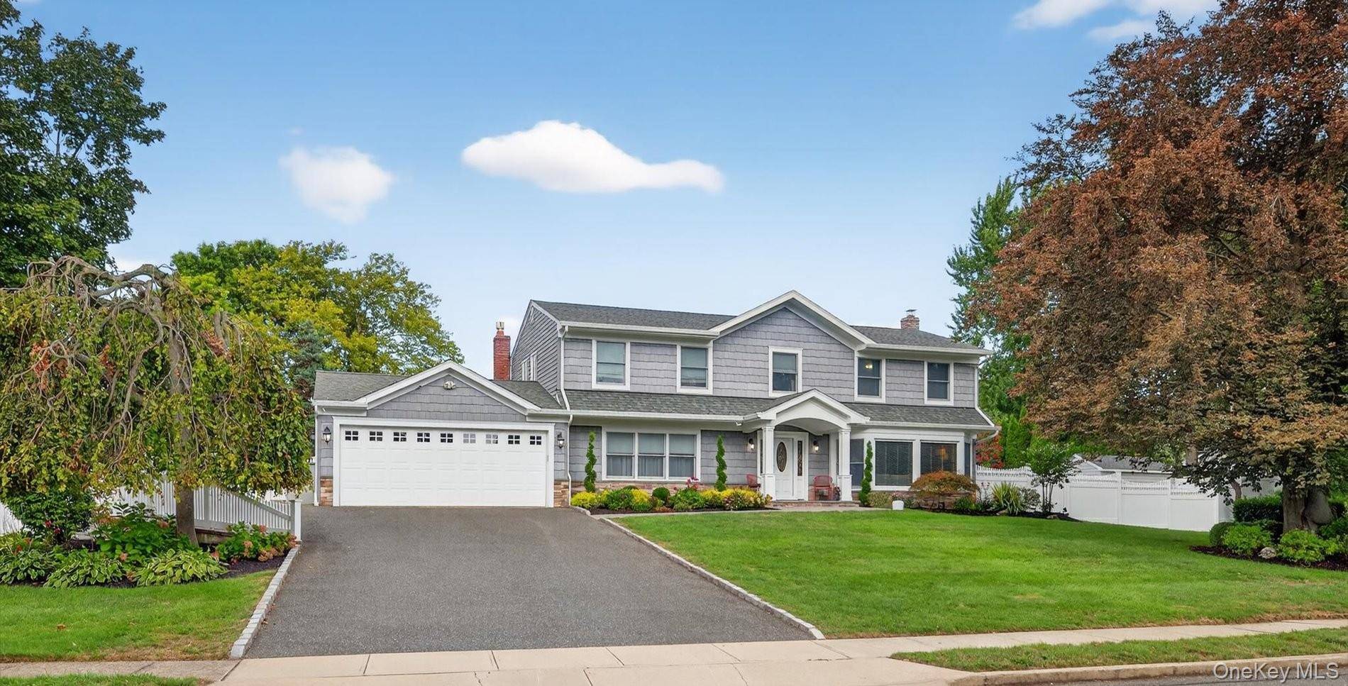 Discover the perfect blend of timeless elegance and modern luxury in this expansive Colonial home featuring 6 spacious bedrooms and 4 beautifully updated bathrooms.