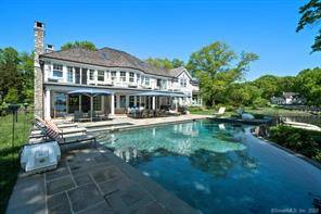 This waterfront oasis built in 2011 is on a sought after cul de sac with breathtaking views of Holly Pond and beyond from almost every room.