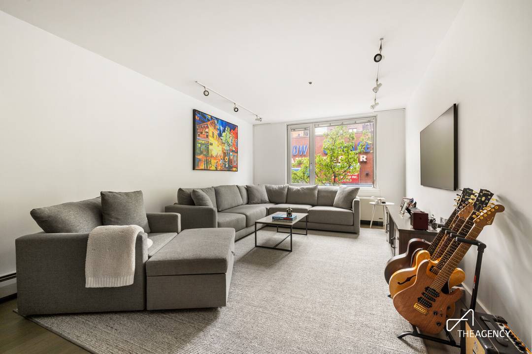Loft like living on the LES courtesy of this truly expansive 1 bed home that features Over 350 sq.