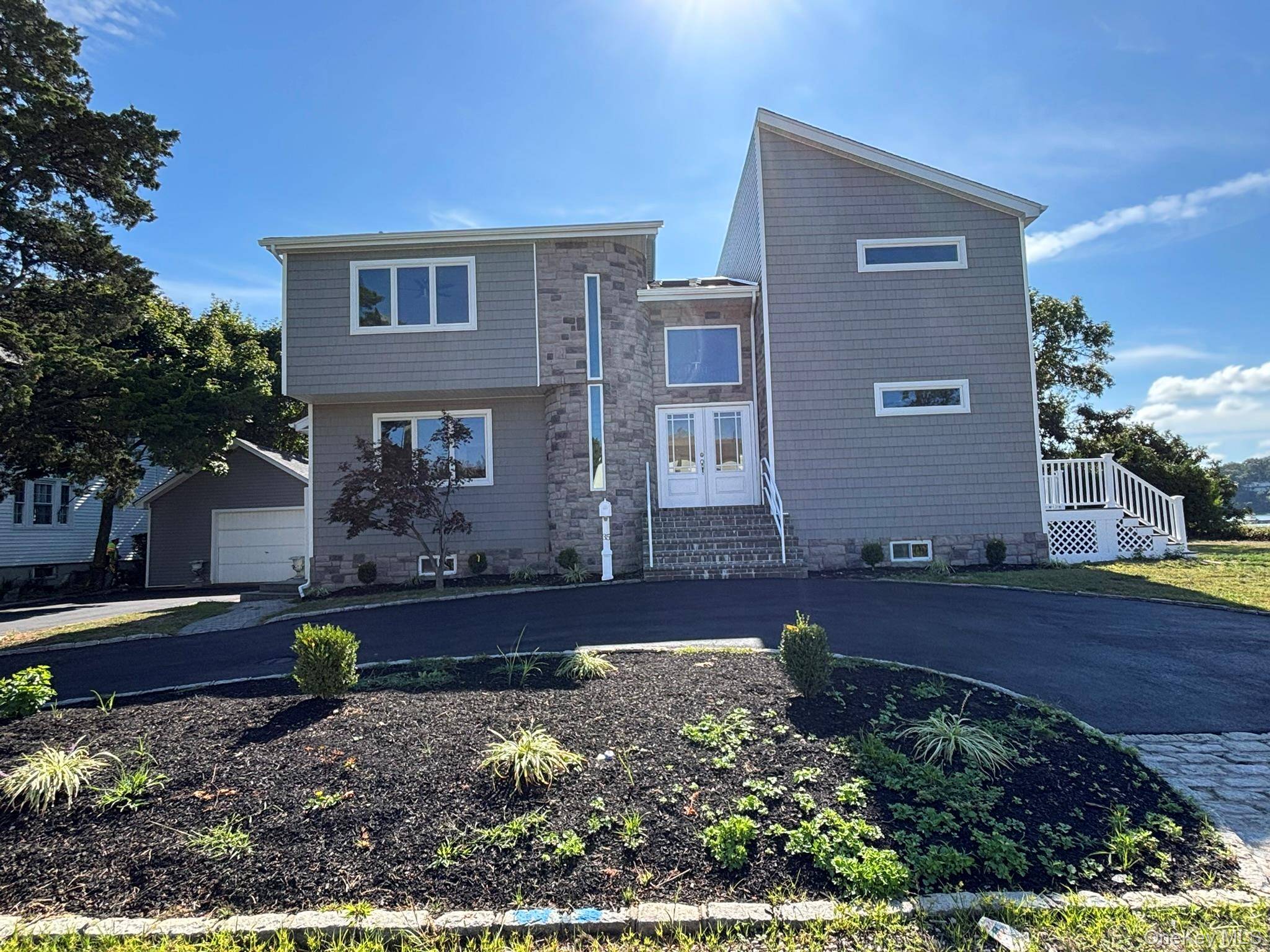 welcome to this waterfront contempary colonial, fully renovated.