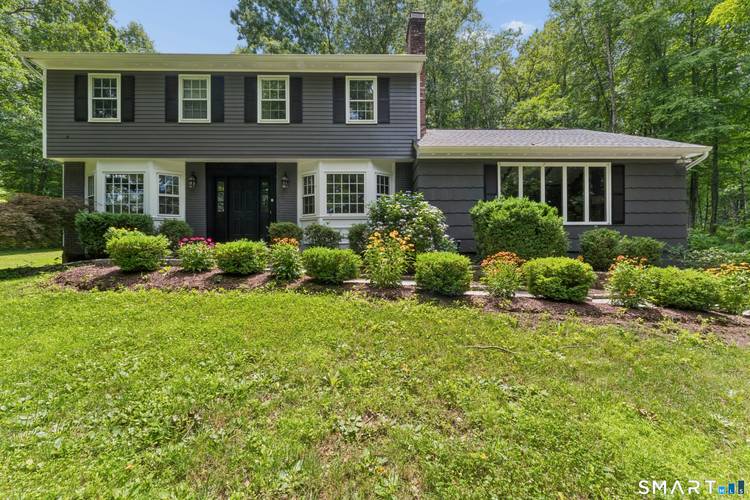 Welcome to this beautifully maintained Colonial, perfectly situated on 1.