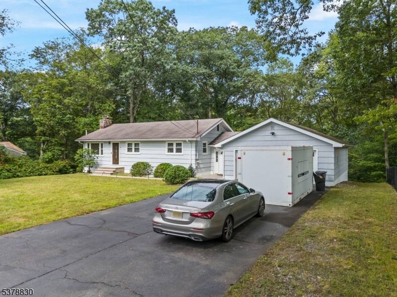 Welcome to this beautifully updated ranch with scenic views backing to Carib Pond.