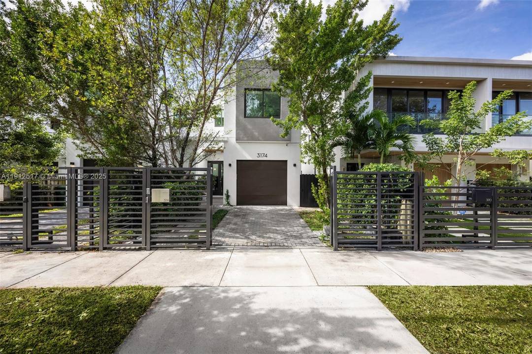 Modern elegance and Coconut Grove charm converge in this gated 2020 townhome featuring 3 bedrooms, 4 baths, and a flexible den.