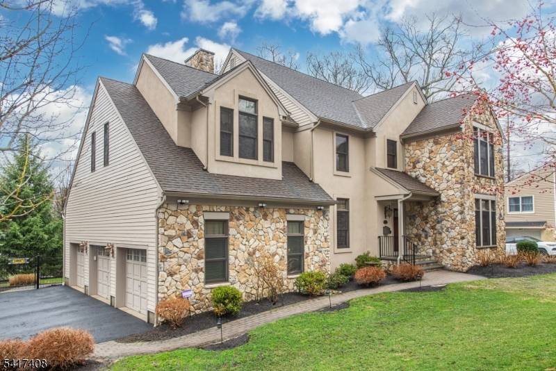 Situated in the coveted Park section, this custom stone and stucco colonial, built in 2006, effortlessly blends timeless sophistication with modern living.