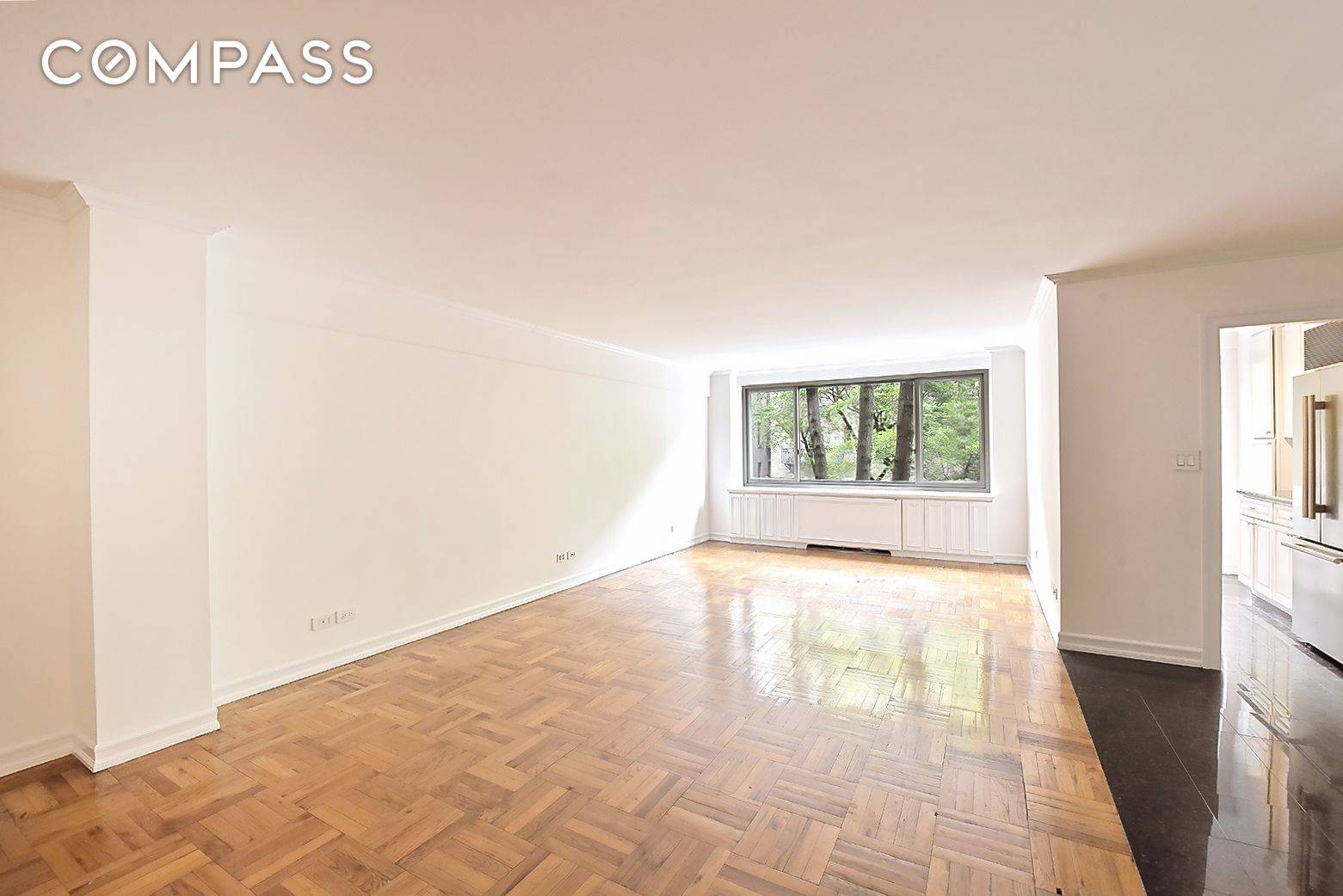 Welcome to this charming residence on East 64th Street, where timeless elegance offers a canvas ready for your personal touch.
