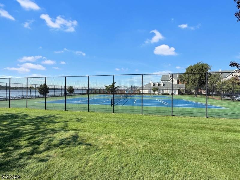 Estate Sale. Spacious 2BR 2BA multi level townhome located in the sought after Society Hill community at 20 Redwood St, Jersey City.