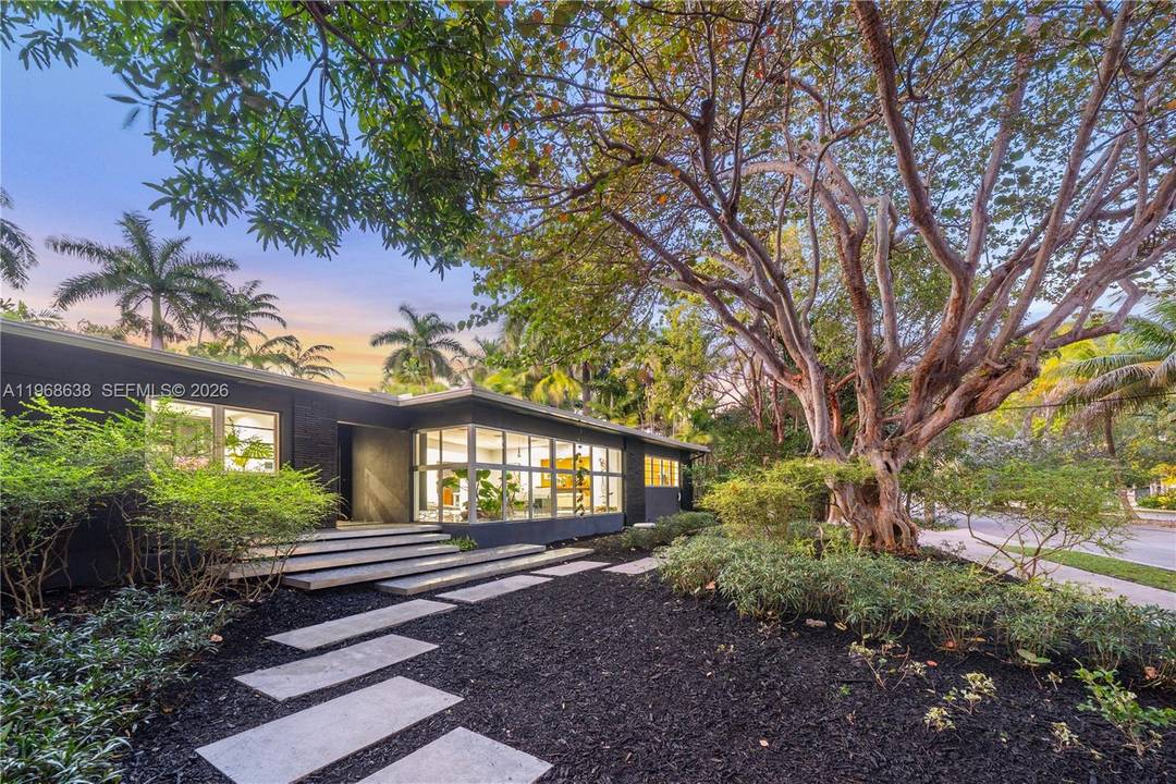 Set on one of the most coveted streets in guard gated Morningside, this architectural gem rests on an expansive 12, 633 sq.