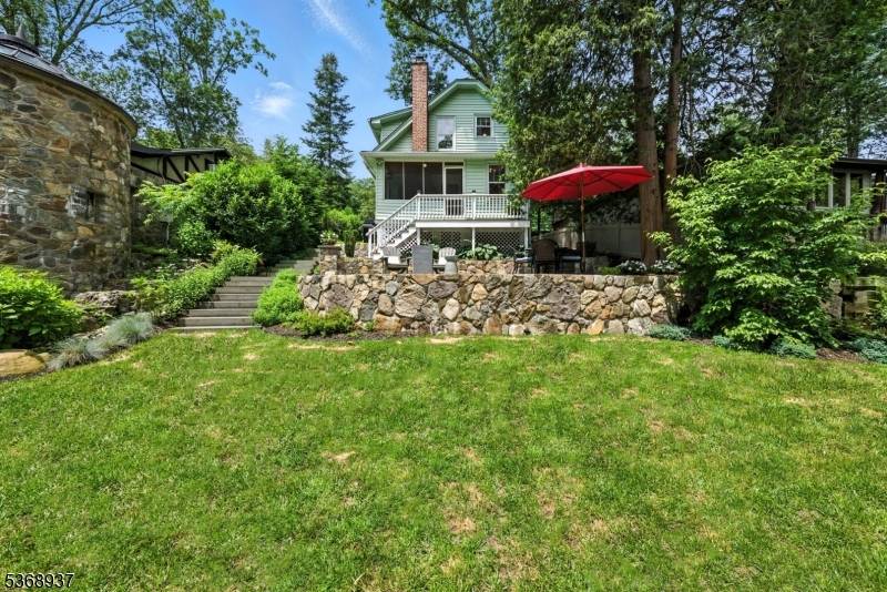 Welcome to 17 Rockaway Drive, a whimsical riverfront retreat nestled in sought after Boonton Township.
