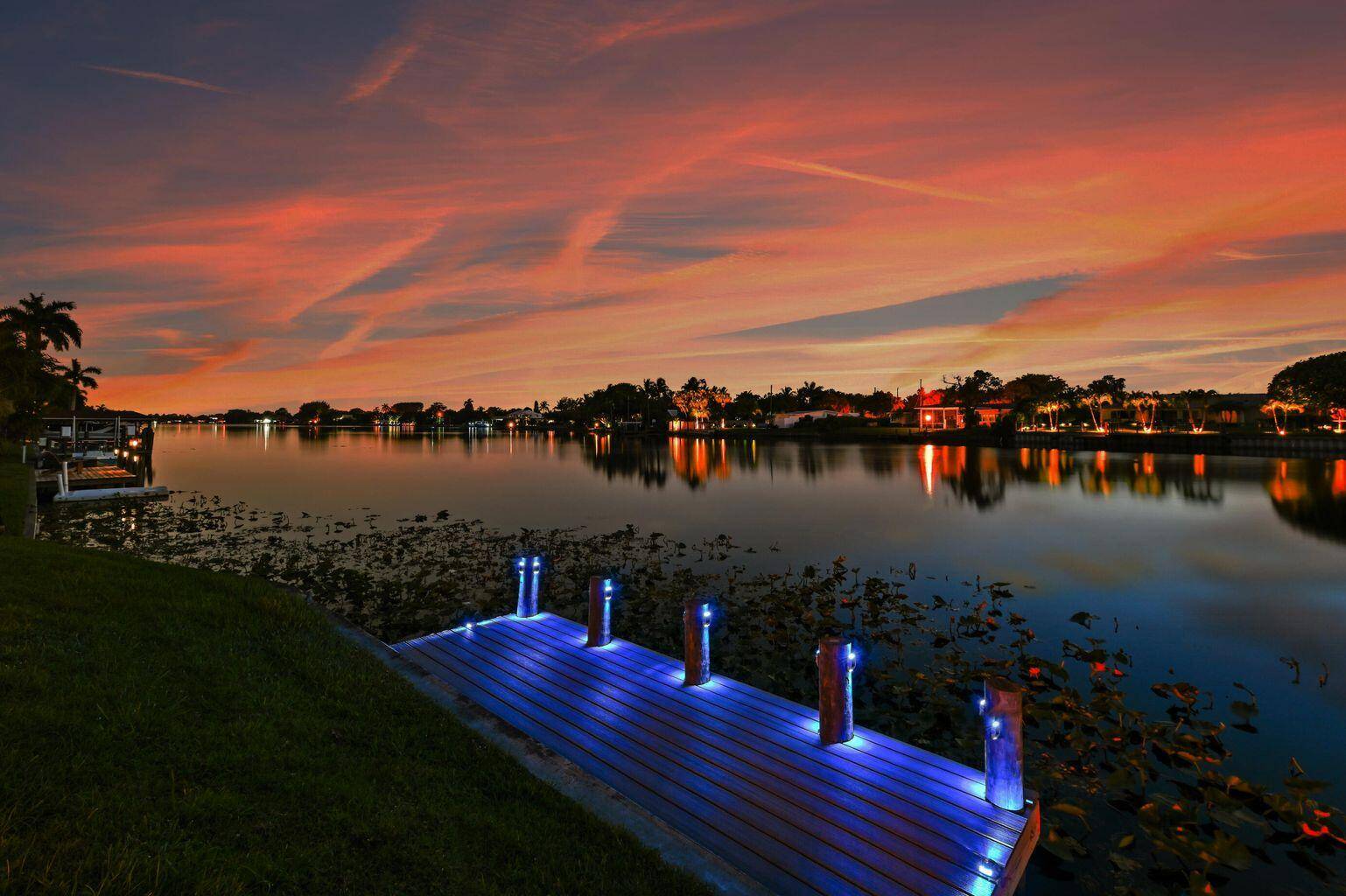 Exceptional Lake Clarke Shores pool home with approximately 100 feet of lake frontage and a private dock.