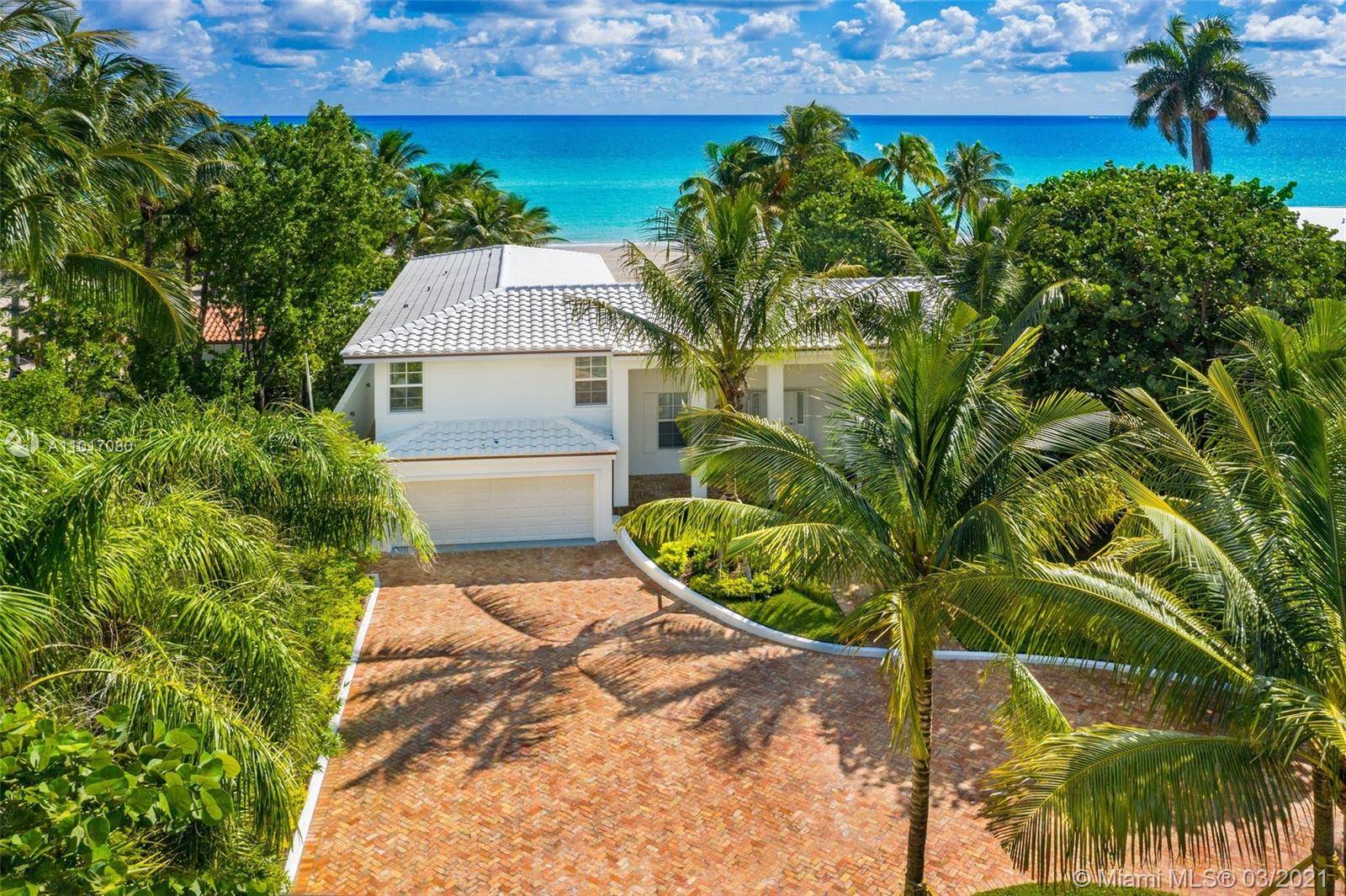 Enjoy the ultimate in beachfront living in prestigious Golden Beach.