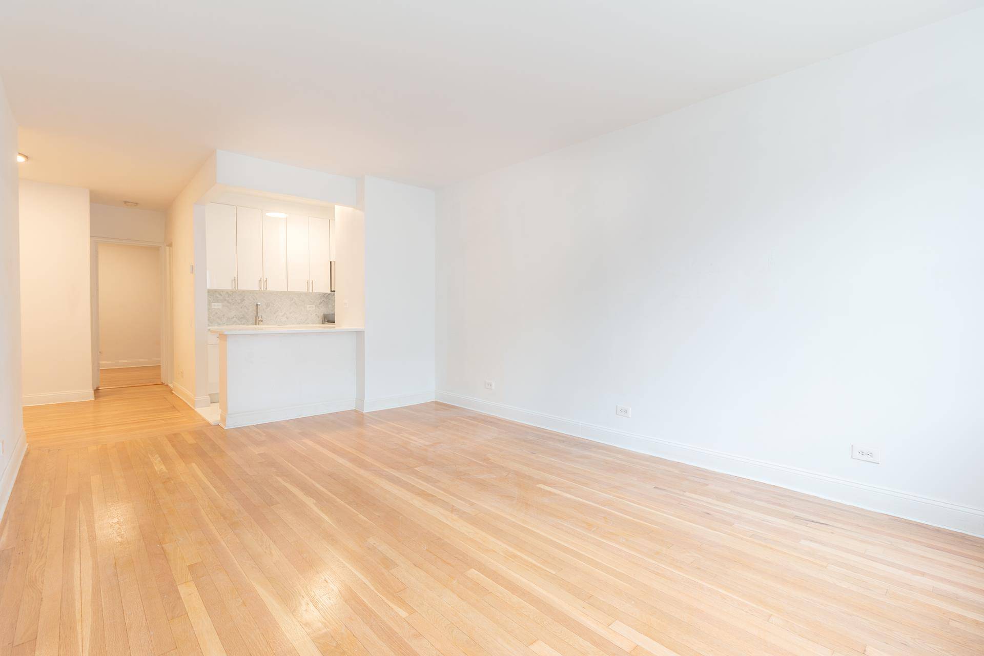 Inviting amp ; Bright South amp ; East Facing One Bedroom Apartment Features a Newly Renovated Open Kitchen with Brand New Quartz Countertop amp ; Island, Marble Herringbone Backsplash and ...