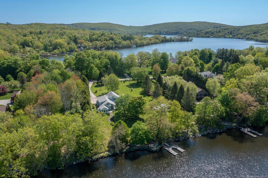 Rare Direct Waterfront Lake Waramaug 5 bedroom 3 full 2 half bathroom home with stunning western views on beautifully maintained double lot.