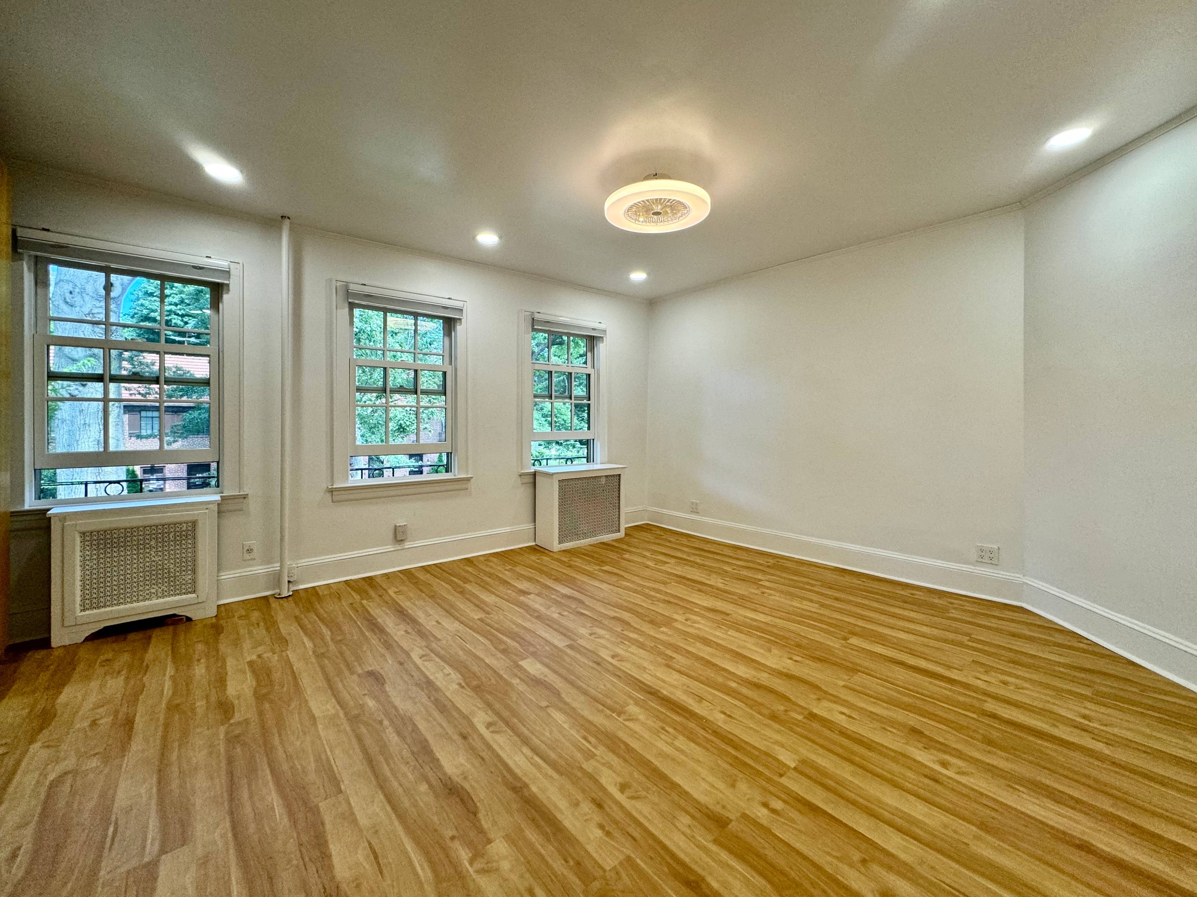 Lower triplex unit in 2 family townhouse in Forest Hills Gardens.