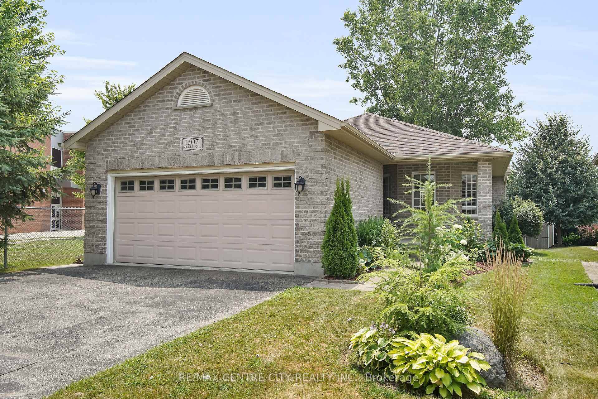 Some creative landscaping and covered front porch invites you inside this spacious immaculate open concept bungalow.