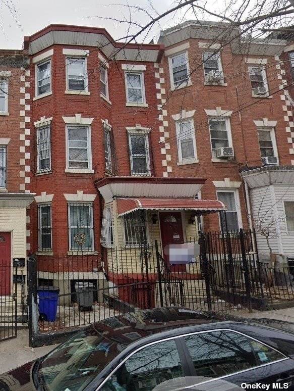 Fantastic investment ! This attached brick two family home has 6 bedrooms, 4 baths, and around 2, 200 sq ft of space on a 20'x75' lot.