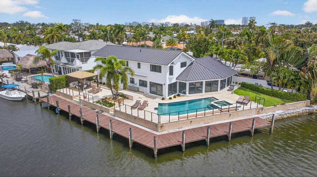 Rare point lot with almost 200 feet of waterfront and dock less than two miles from the beach !