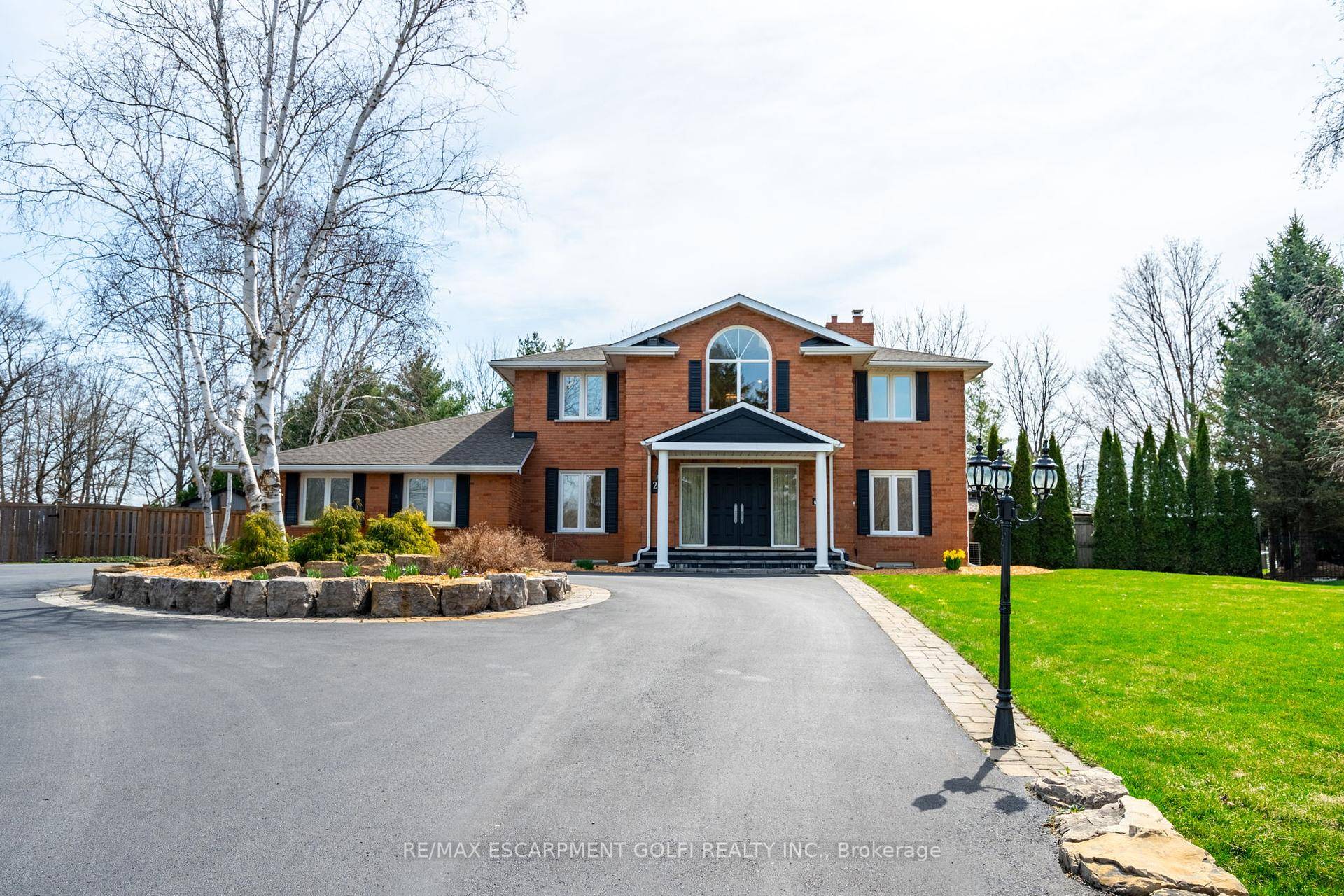 Situated on a quiet, beautifully manicured 0.