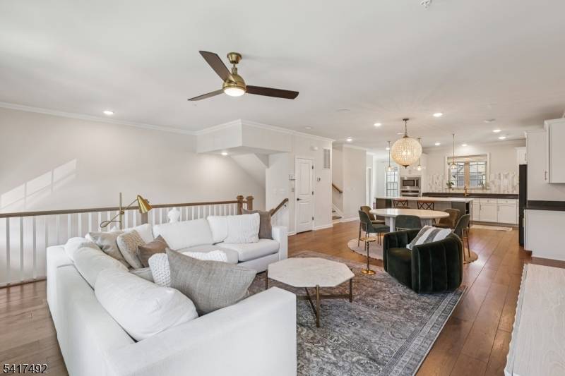 Welcome to this beautifully appointed Isleton model end unit townhome in the sought after Fairview at Warren community by Pulte Homes.