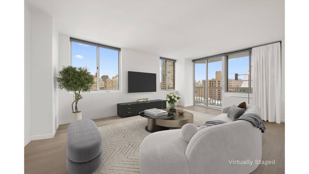 Enjoy open city views and unforgettable sunsets from this high floor one bedroom with flexible second bedroom and two full baths at the highly coveted 50 Lexington Avenue.