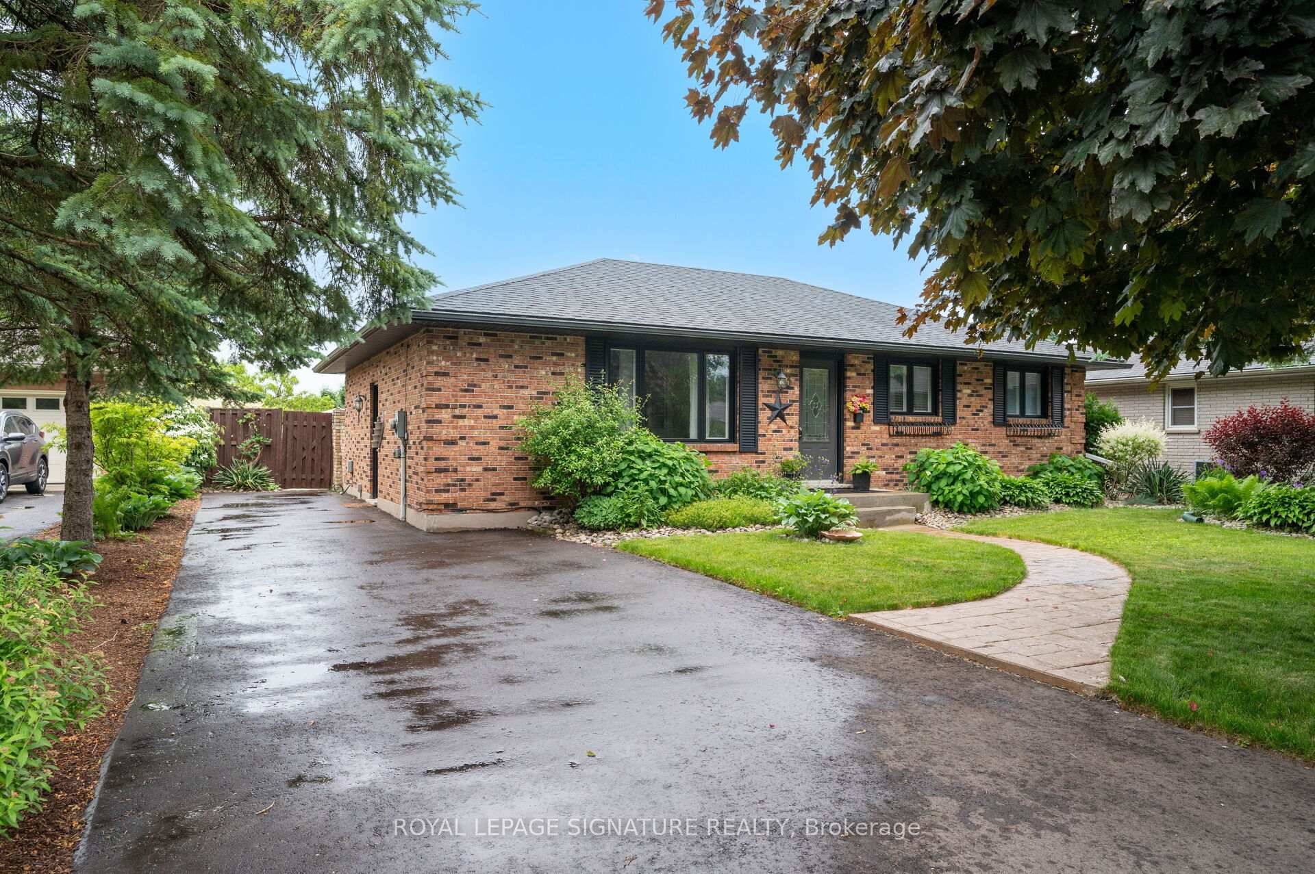 Beautifully maintained 3 bedroom brick bungalow featuring hardwood floors throughout the main level.