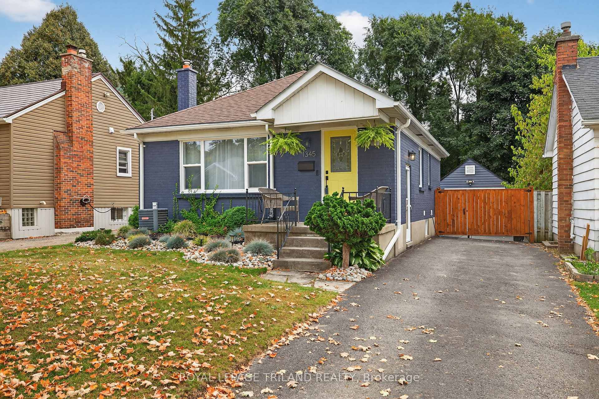 Welcome to 1345 Langmuir Avenue, a fully renovated bungalow on a 39' x 139' lot surrounded by mature trees, offering privacy and a serene East London setting.