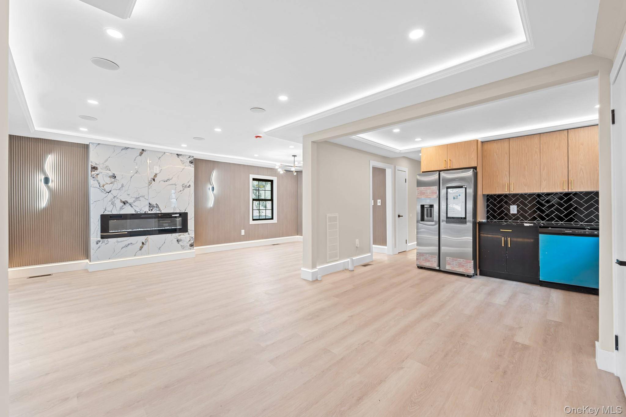 Remarkable and classically renovated brick two family nestled on a beautiful tree lined street of Springfield Gardens.