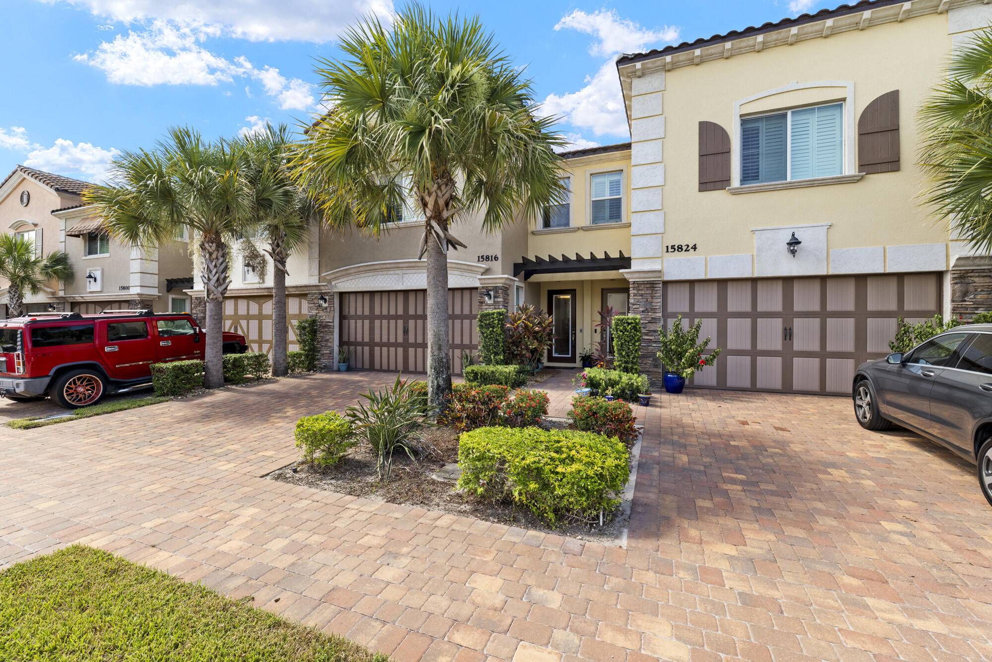 Stunning 3 bedroom townhome in gated Binks Pointe that overlooks the 4th hole of Wellington National Golf and preserve.