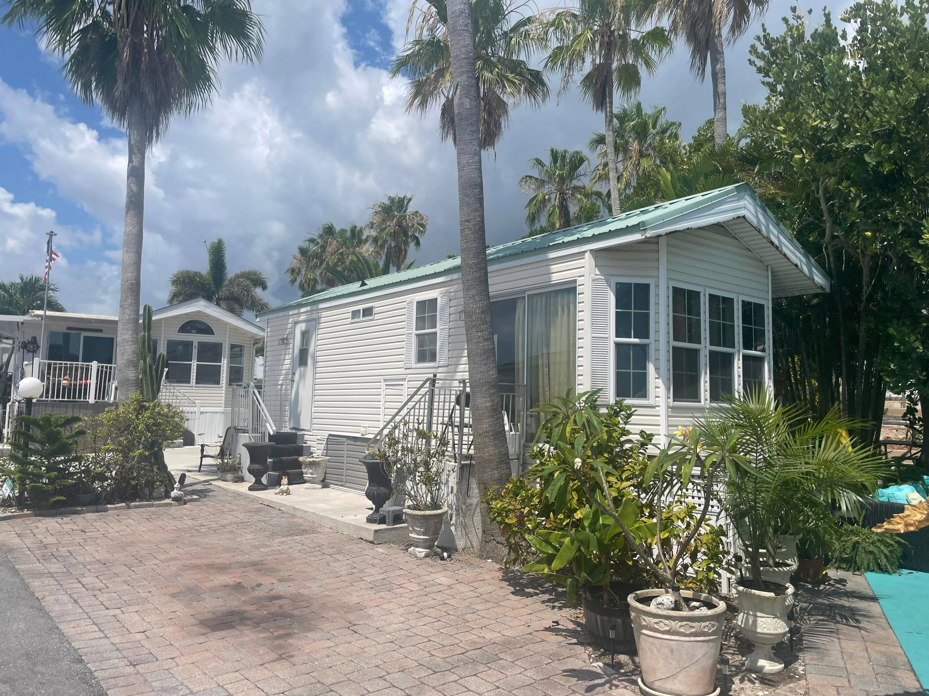 Great opportunity to own your lot and trailer in Juno Ocean Walk located approximately 300 yards from Juno Beach and Pier !
