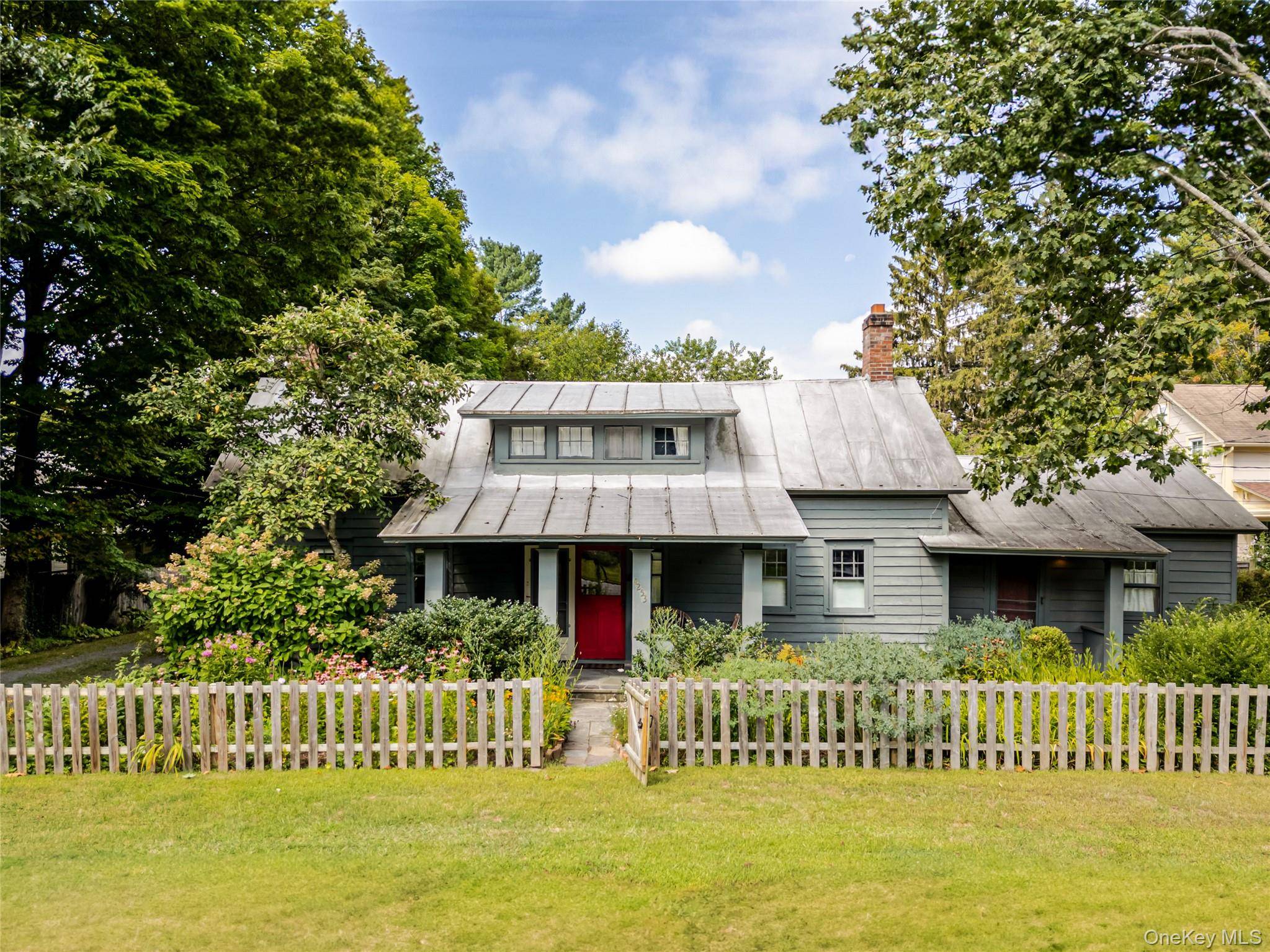 Introducing Woodbine Cottage, a storybook Colonial built circa 1800, filled with old world character and timeless charm.