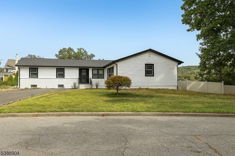 Welcome home to this exceptional 3 bedroom, 2 bathroom open concept Ranch, nestled on an oversized corner lot with what might be the best panoramic lake views in town !