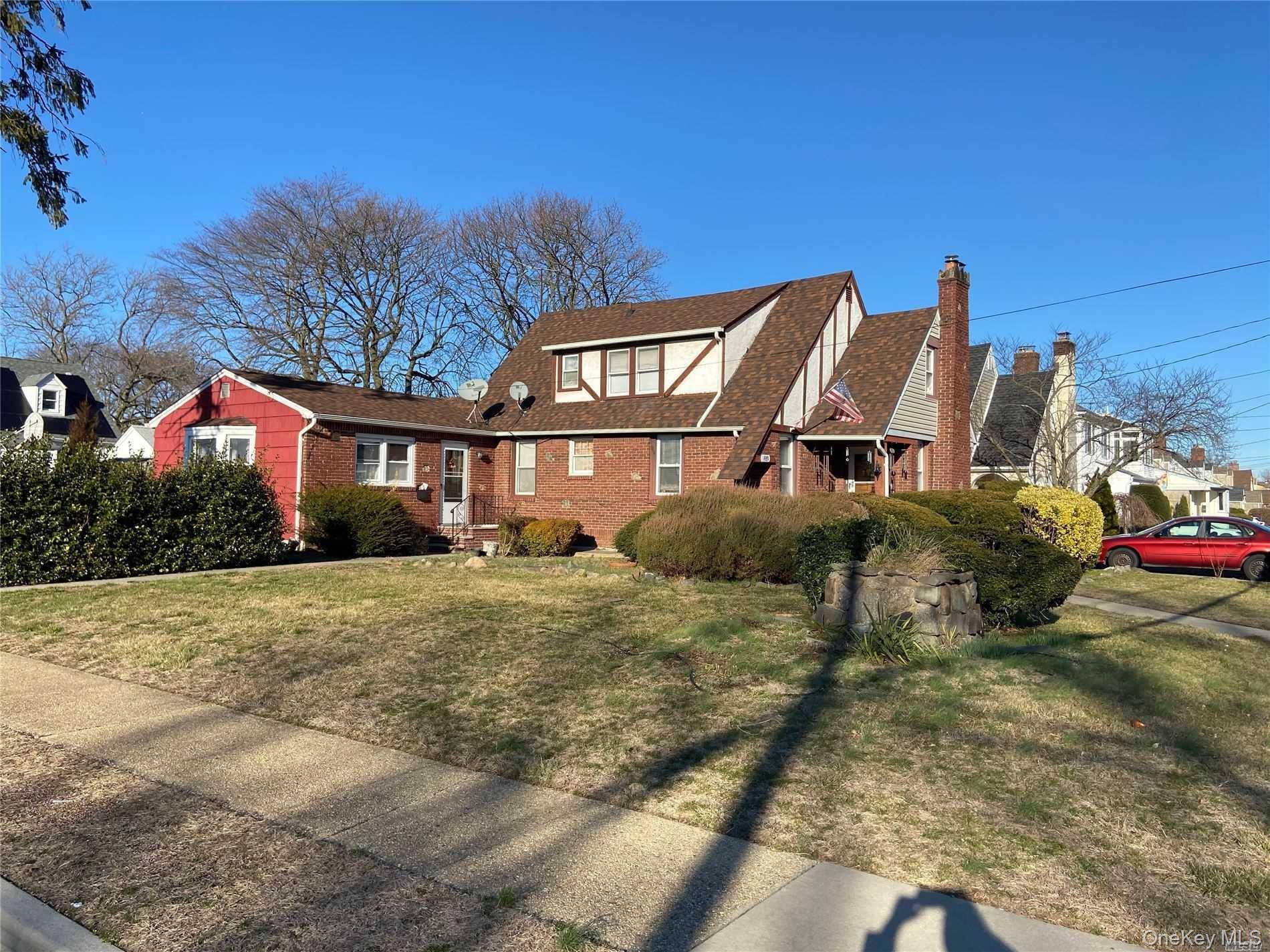 Welcome to this classic brick Tudor, offering timeless character and incredible space.