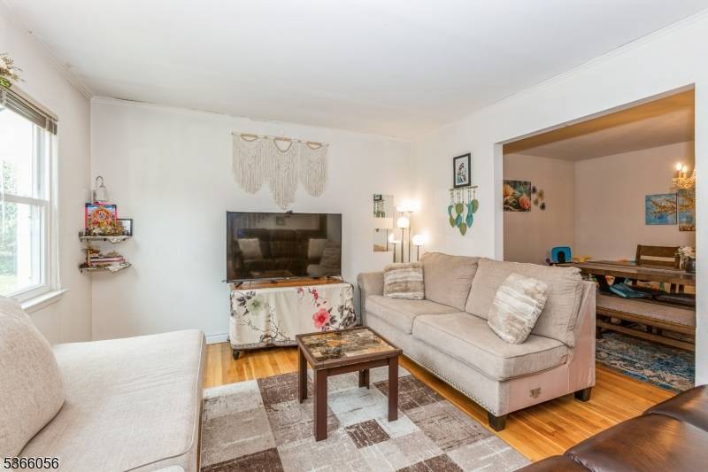 Welcome to 8 Longfellow Drive, a beautiful Cape Cod style home located in the highly sought after Colonia Estates section of Woodbridge Twp.