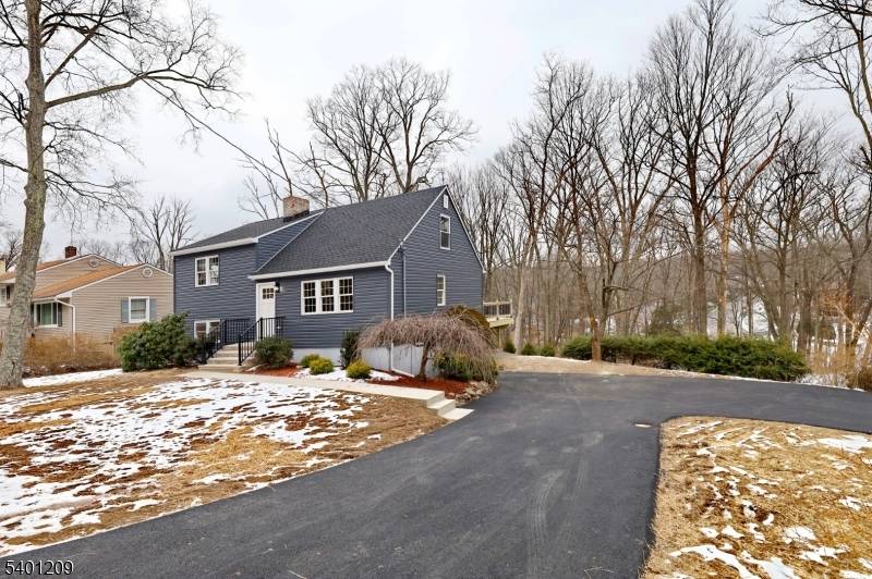Modern fully renovated inside and out split level on an acre of the lot.