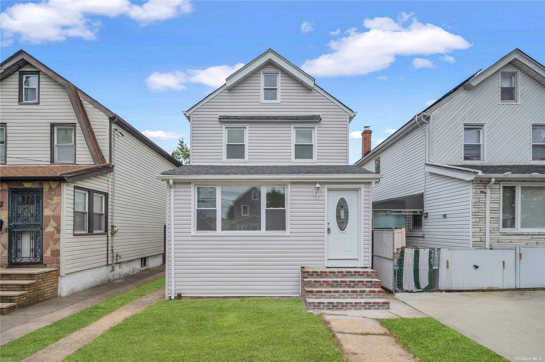 This completely renovated 2 family home offers a modern and comfortable living space.