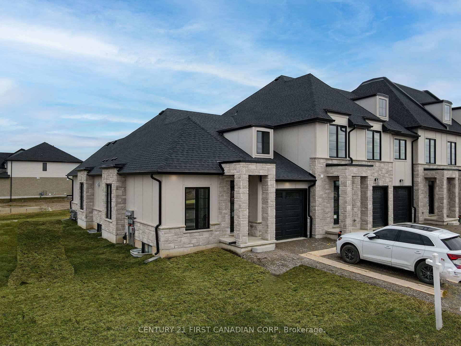 The Belfort Bungalow has Grand Curb Appeal on each end of the Lambeth Manors Townblock.