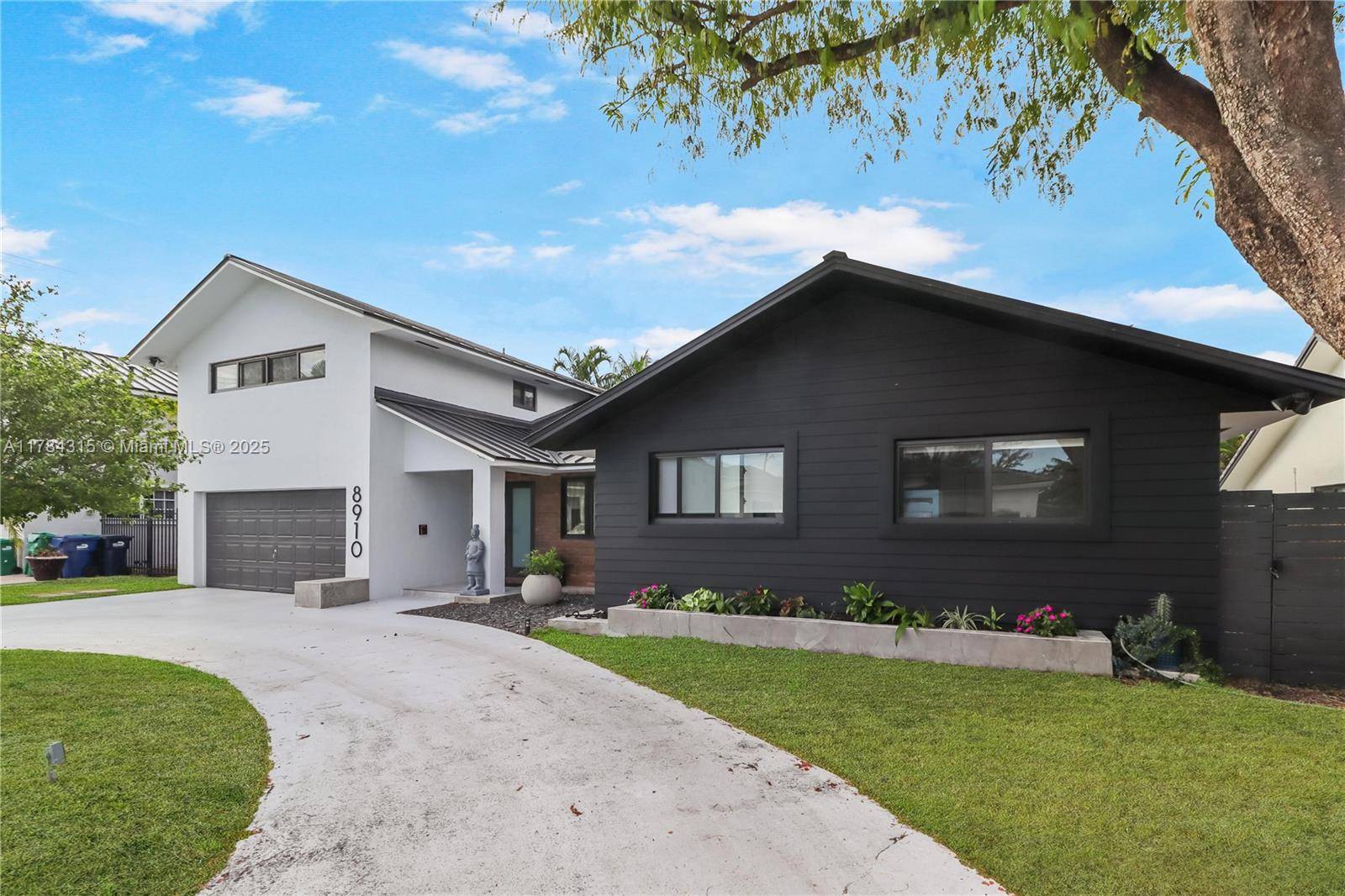Enjoy Palmetto Bay living at its finest in this architecturally delightful home with striking vaulted ceilings and abundant natural light throughout the fabulous open concept living space, featuring formal living ...