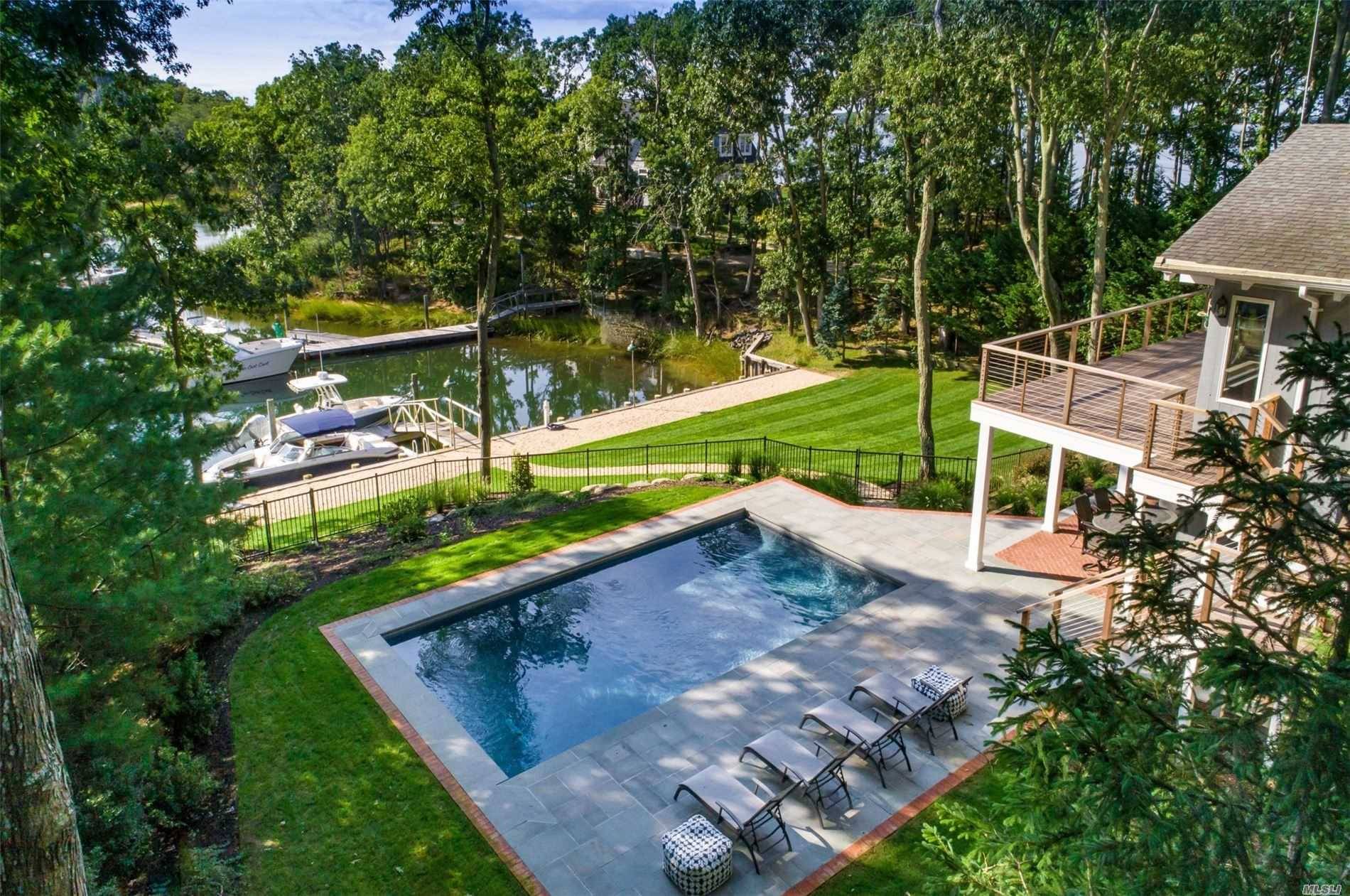 Perfect home with plenty of room to work and play 4 bedrooms, 4 baths, sauna, pool, dock, outdoor decks on two levels.