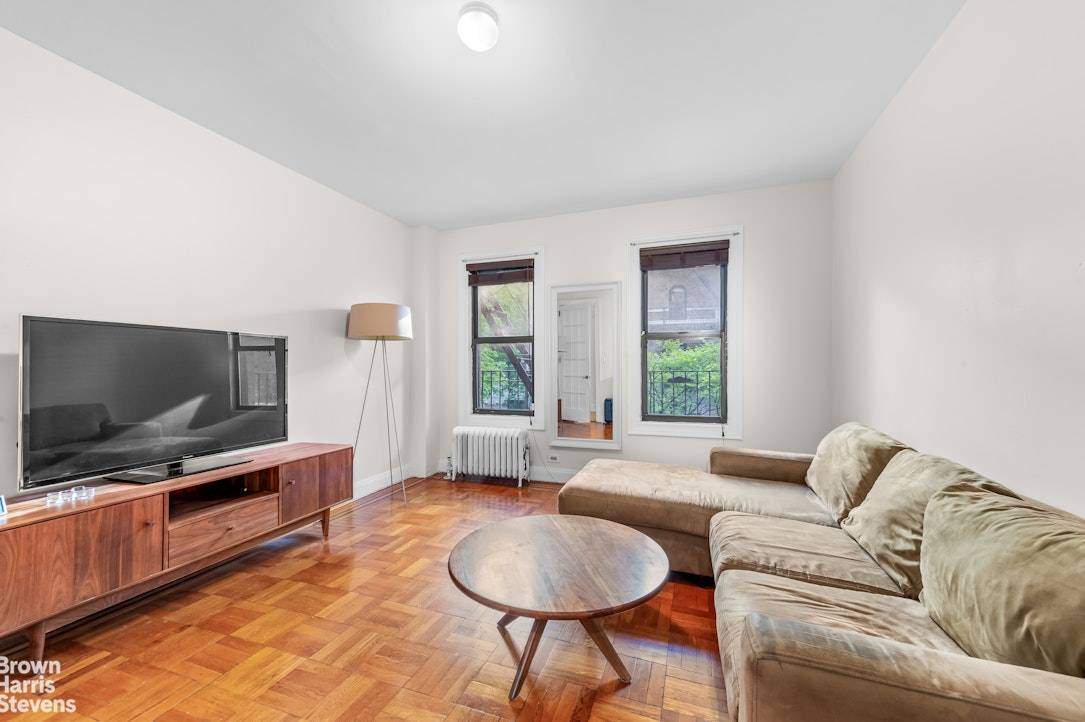 Welcome to this spacious three bedroom apartment located on a charming tree lined street in a stunning prewar building.