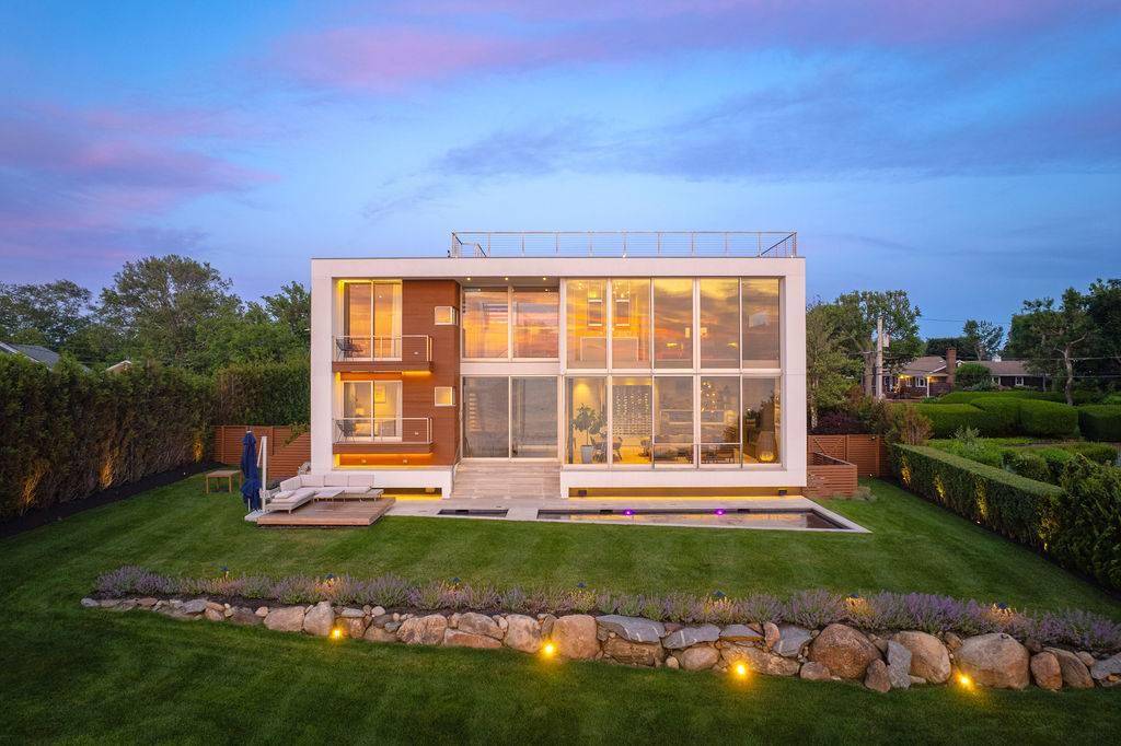 Cutchogue Showstopper ! Designed by world renowned architects Barnes Coy, this modern waterfront masterpiece is a rare blend of cutting edge design and natural beauty.