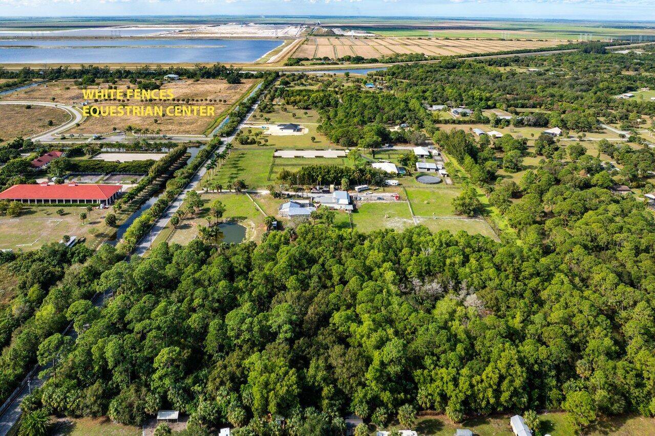 This 5 acre high and dry beauty features ; a dead end paved road with minimal traffic, mature hardwood trees and perfect for a private home site, equestrian farm, nursery, ...
