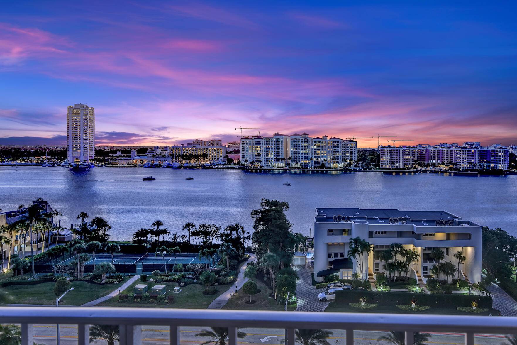 Waterfront two bedroom, two bathroom residence, offering spectacular views of Lake Boca, the city, and breathtaking sunsets.