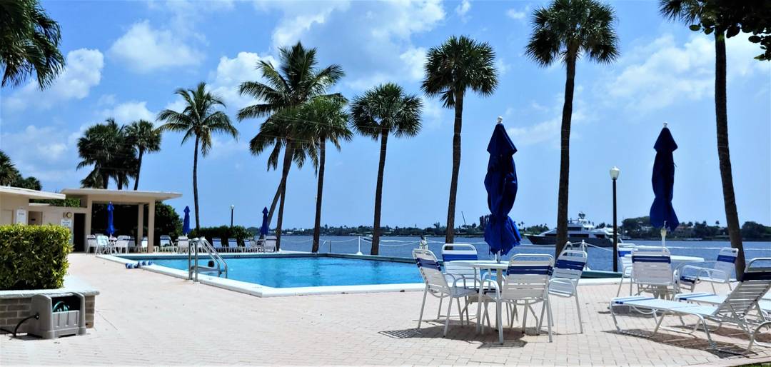 Beautiful three bedroom waterfront residence offering sweeping water and Palm Beach views from every room.