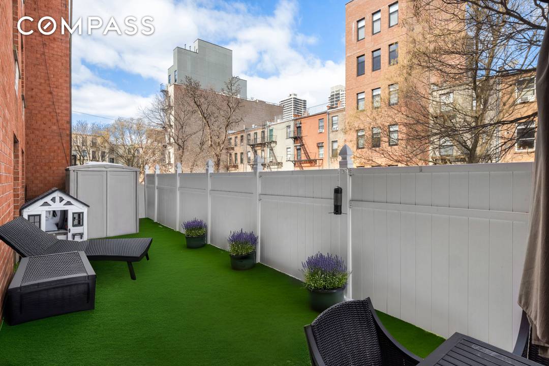 This stunning East Harlem 2 bedroom, 2 bathroom apartment is a standout, featuring designer finishes and an expansive, fenced back patio a rare find in this city.