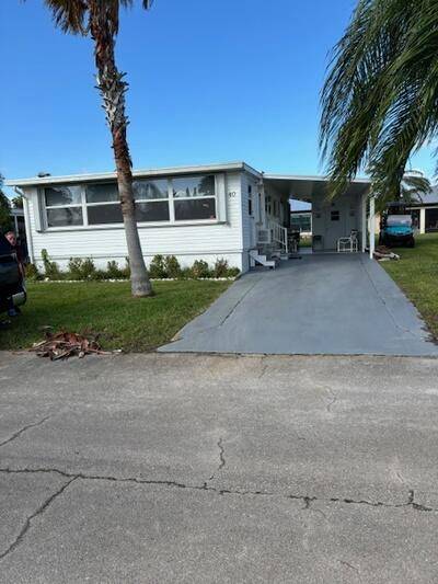 Welcome to this charming mobile home located in the 55 community of Spanish Lakes One.