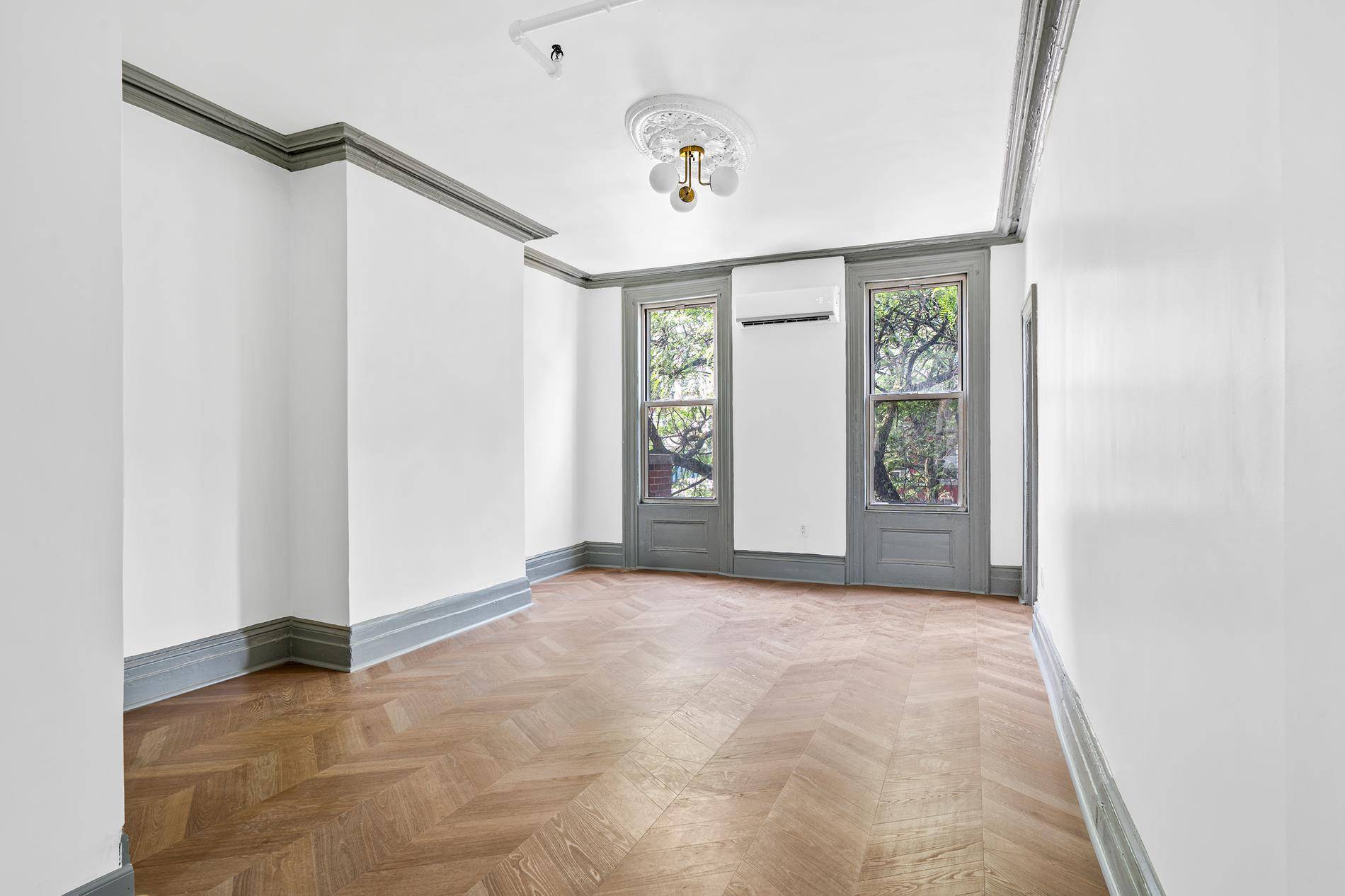 Rare two bedroom flex three right in Court Square on a landmarked street in Long Island City.