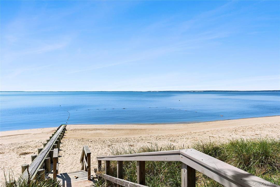 This stunning expanded ranch in the heart of Mattituck offers breathtaking views of Peconic Bay and is just a short distance from its gorgeous private deeded beach.