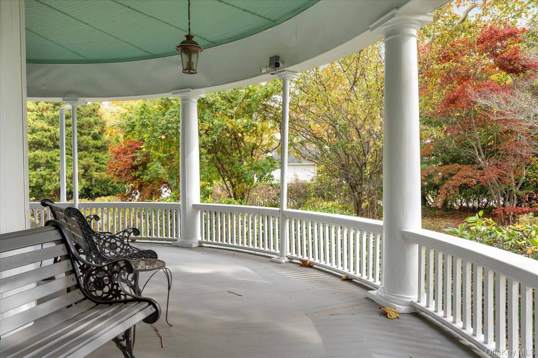 Step into the timeless grandeur of Wisteria Court, one of South Jamesport's most admired historic estates.