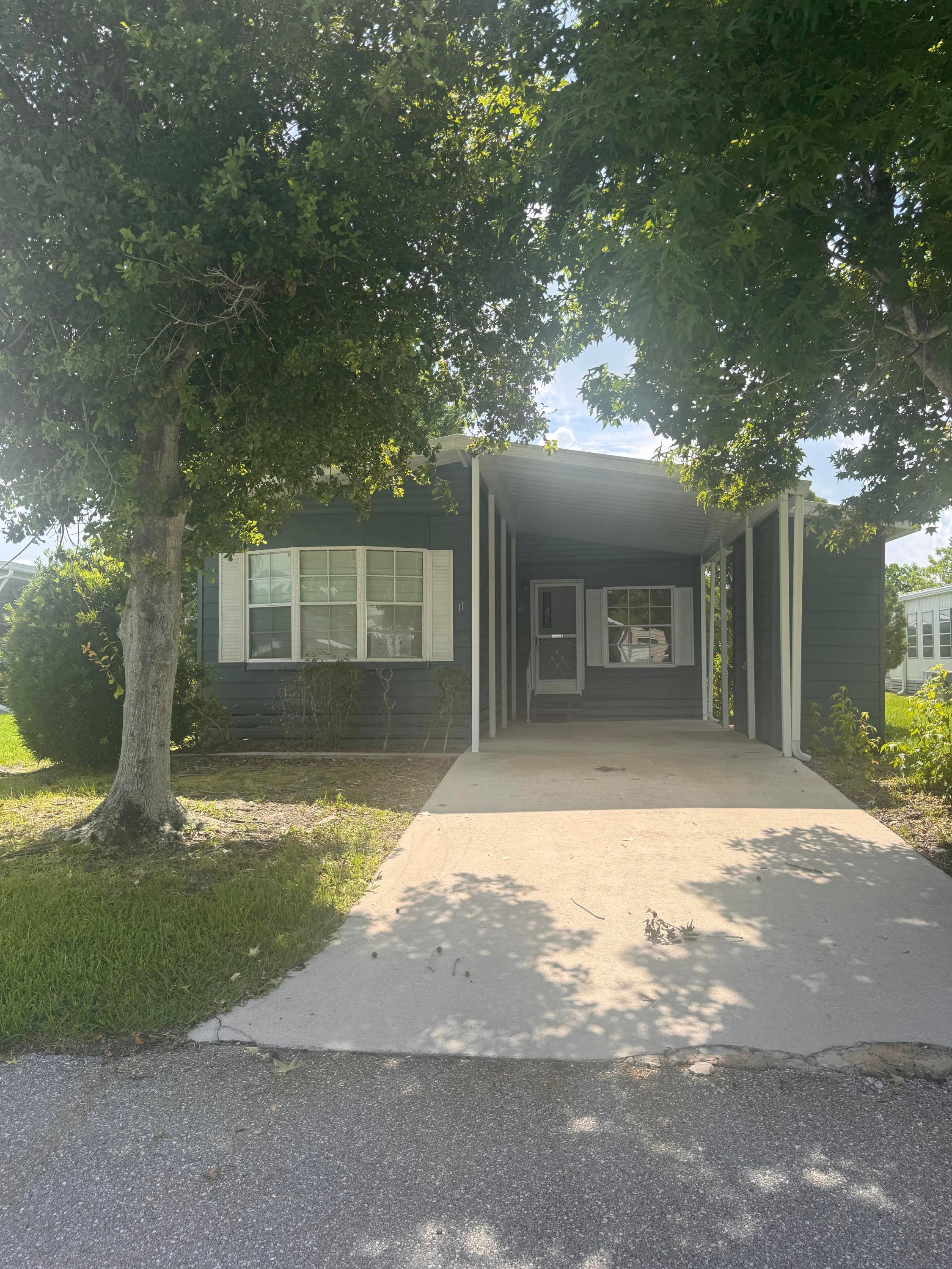 Live the Florida lifestyle in this beautifully maintained 2 bed, 2 bath home located in the sought after land lease community of Spanish Lakes Golf Village !